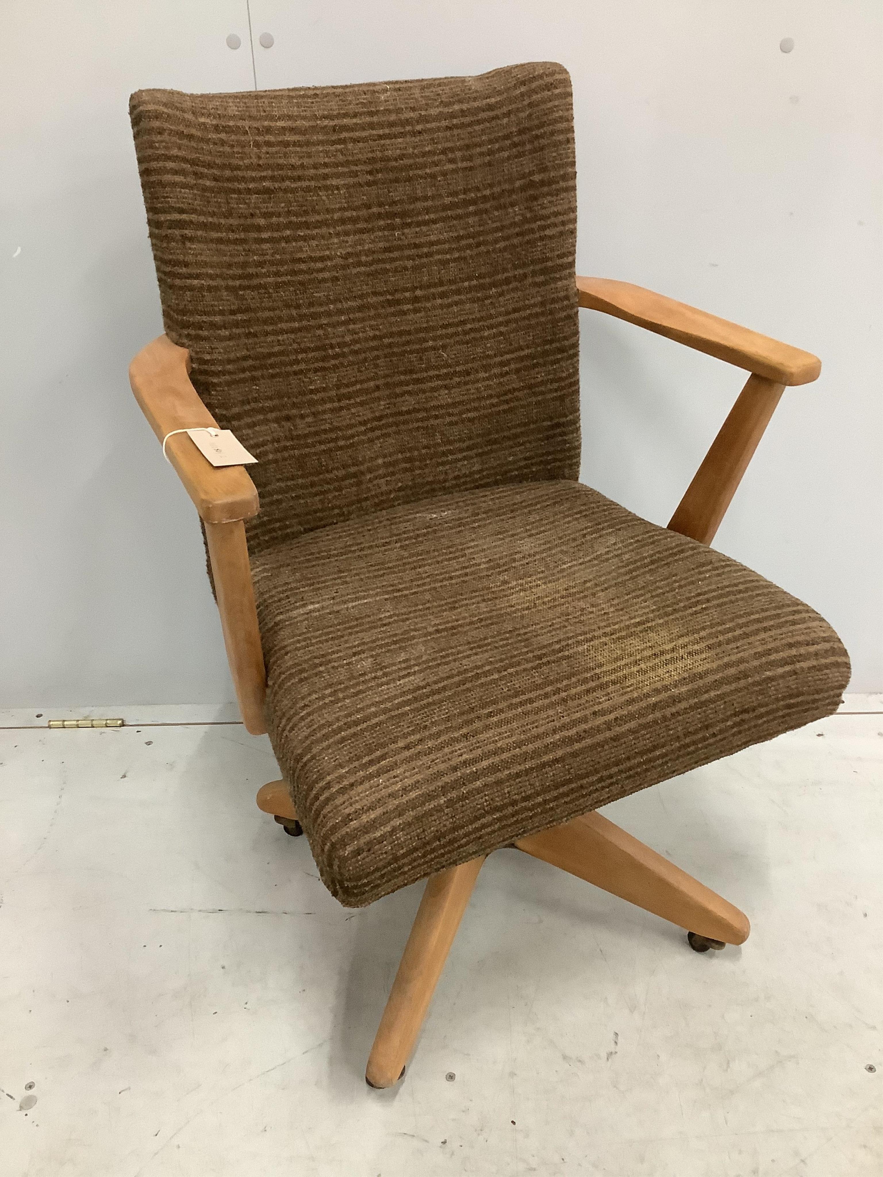 A mid century swivel office chair, width 59cm, depth 45cm, height 88cm. Condition - fair